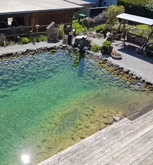 Pool mit Steine und Holz, Schmid-Erdbau, Erdbewegungen, Leiblachtal